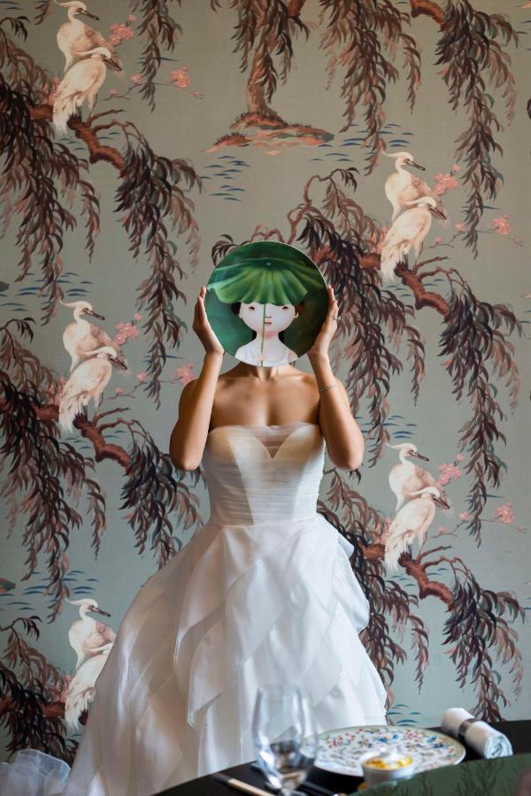 Andaz Singapore, By Hyatt Kültér fotó A model wearing a dress by the designer